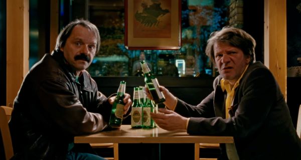 two men drinking beer